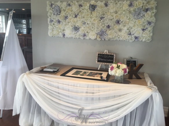 white drapery reception table