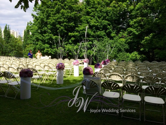 westin-prince-outdoor-ceremony-light-pillars-with-arrangement-purple-branch